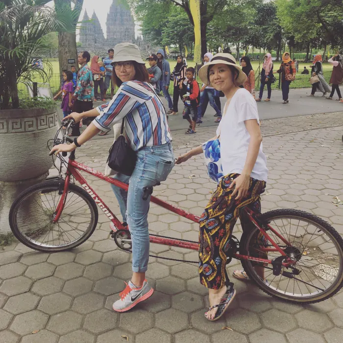 On a tandem bike at a temple
