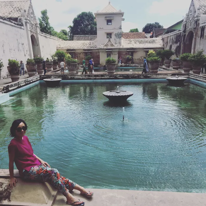Sitting by a palace pool